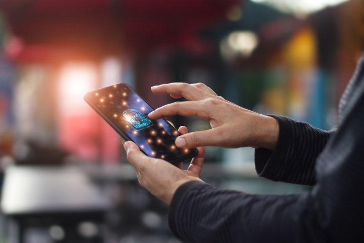 Human touching technology global networking security information safety and encryption with key padlock icon on virtual screen smartphone , Data protection and cyber security network concept.